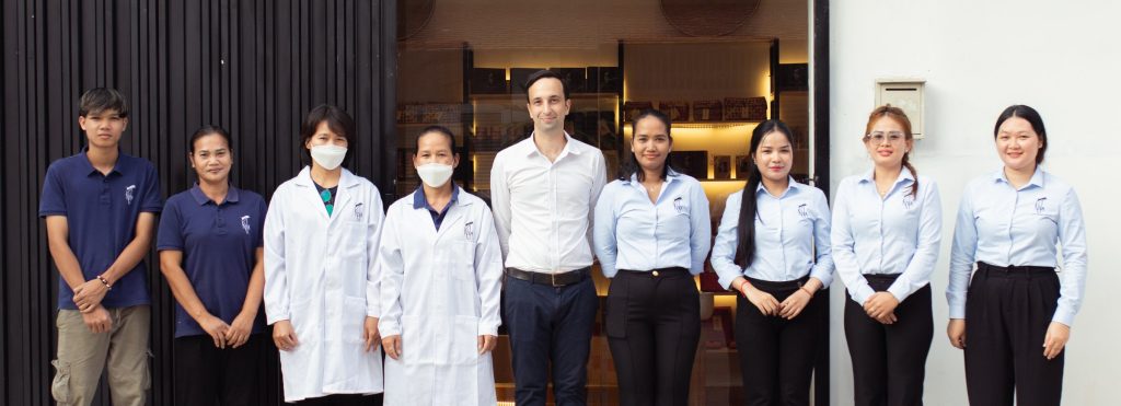 The KHLA team in front of the shop