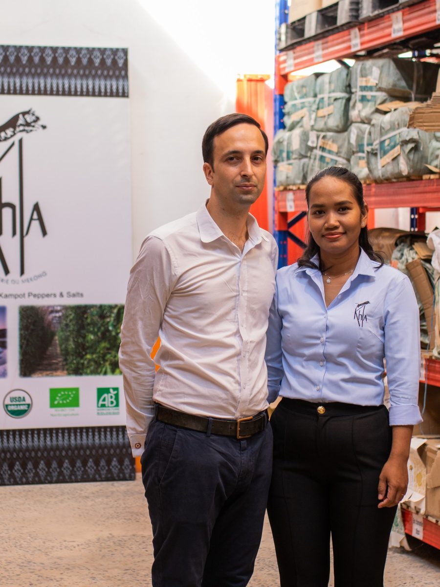 Two members of the KHLA team in the Phnom Penh warehouse