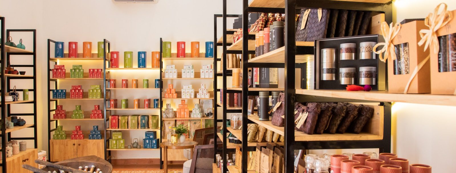 Shelves in the KHLA shop, Asian tea tins and infusion pouches